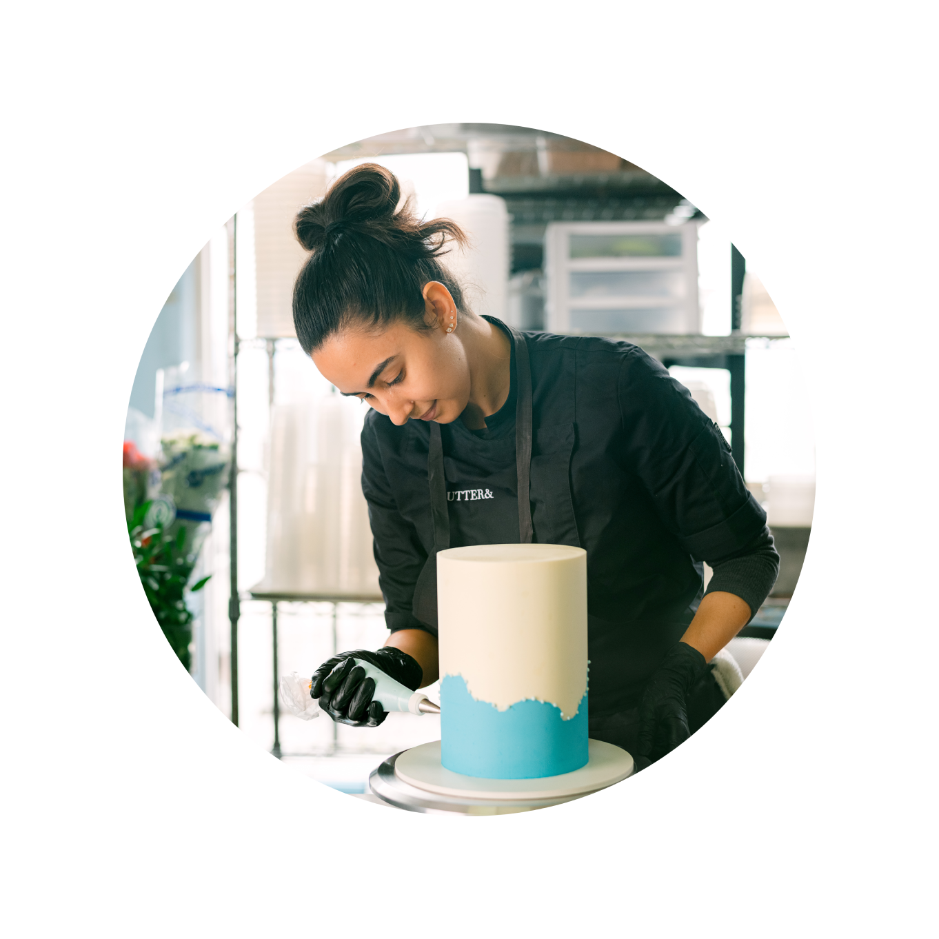 woman icing a cake